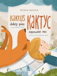 Zdjęcie okładki książki "Kaktus dobry pies". Tytuł napisany w języku polskim i ukraińskim. Poniżej leżący pies i dziewczynka.